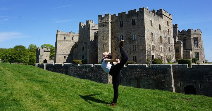 Child dancing outside Raby Castle, County Durham